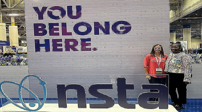 Two female science coaches smiling